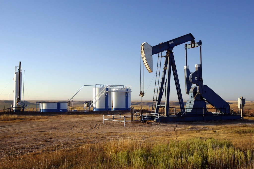 Oil well and storage tanks in the Texas Panhandle.