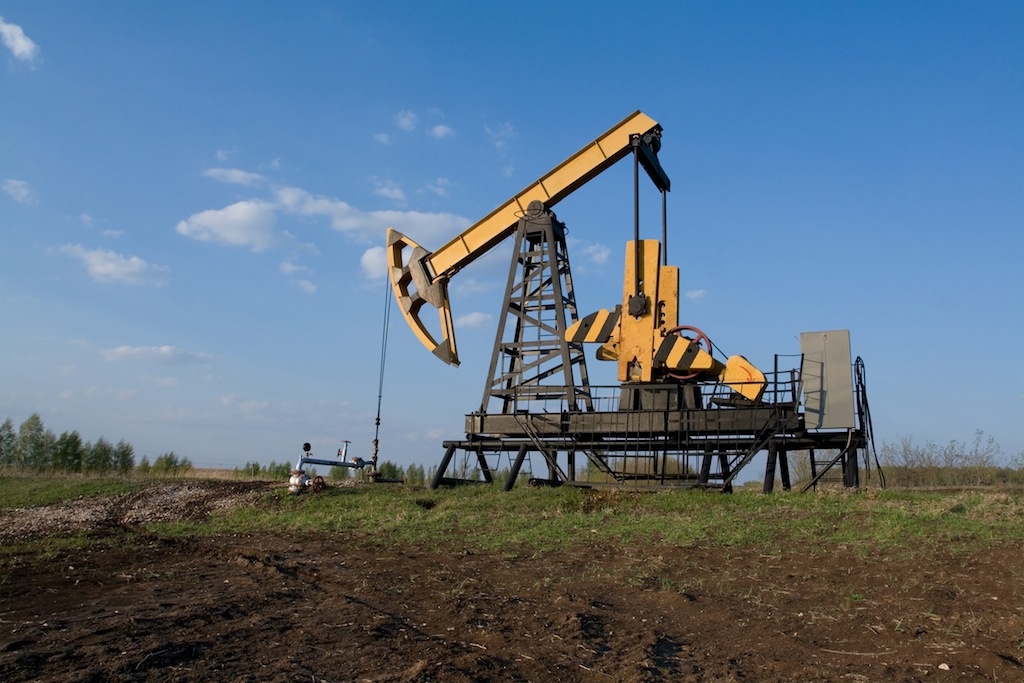 Oilwell on the landscape. Industrial background
