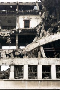 Ruined residential building after strong earthquake eruption